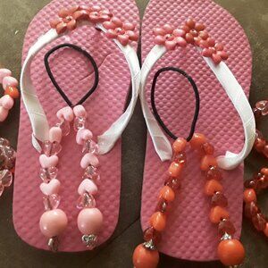 4 bracelets,2 hair accessories , design flip flops.